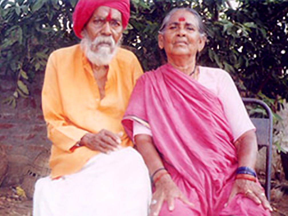 Guruji blessing an elderly devotee